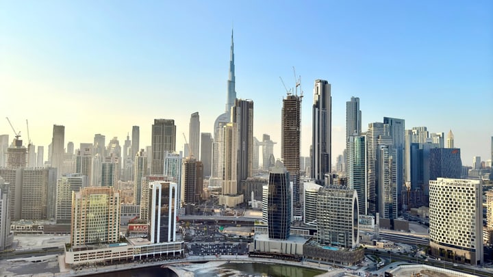 Dubai skyline and Burj Khalifa above Business Bay
